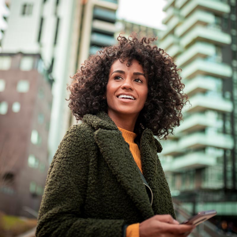 A smiling young woman at the downtown district