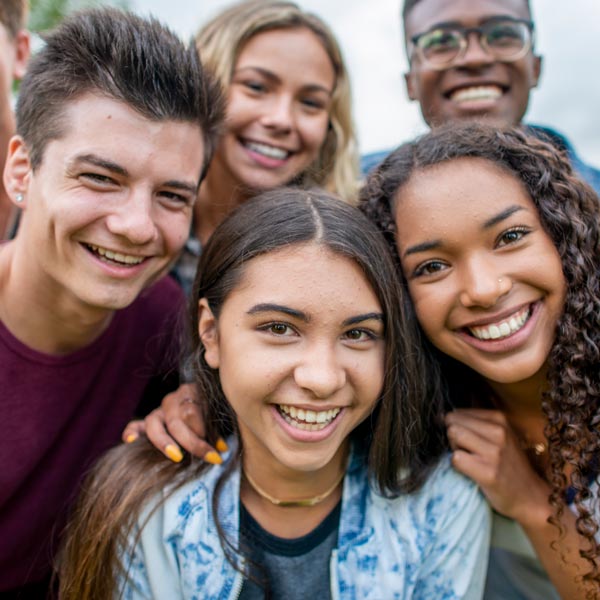 group of smiling teens